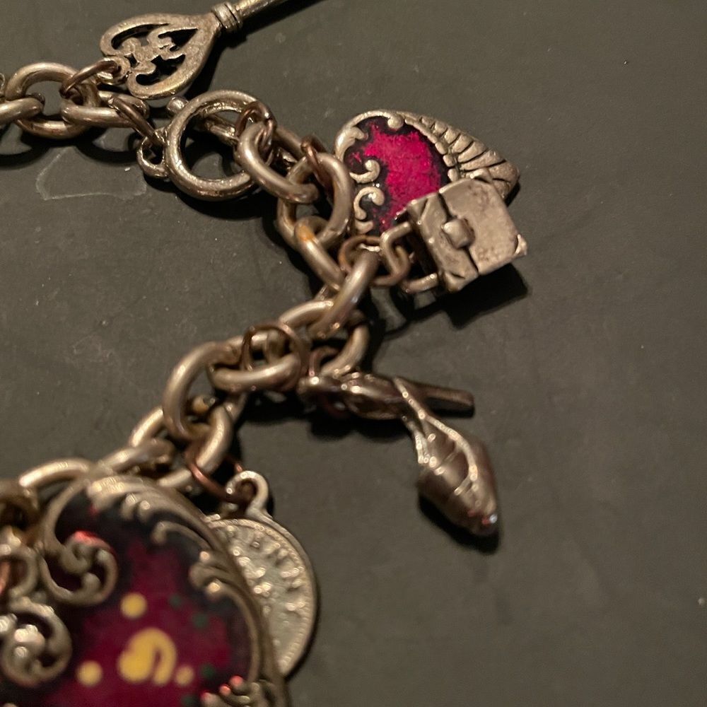 Silver tone Charm Bracelet with lots of Charms. So cute!